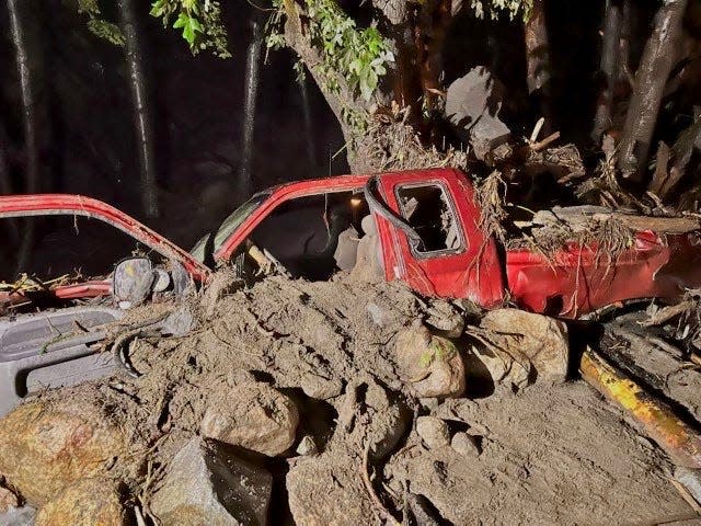 Thunderstorms that hit Siskiyou County on Tuesday night caused flash floods and mudslides. This truck got caught  in the mud at a bridge near Humbug Road in the McKinney Fire area.