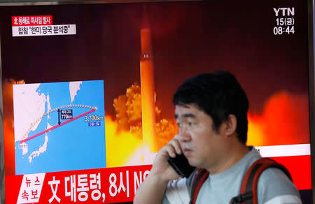 A man watches a television broadcasting a news report on North Korea firing a missile that flew over Japan's northern Hokkaido far out into the Pacific Ocean, in Seoul, South Korea, September 15, 2017. REUTERS/Kim Hong-Ji