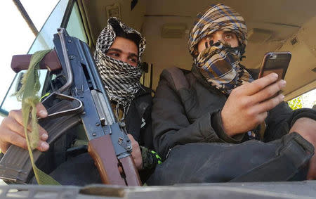 Rebels are seen in a bus as they are evacuated from the town of Douma, eastern Ghouta, in Damascus, Syria April 1, 2018. REUTERS/Bassam Khabieh