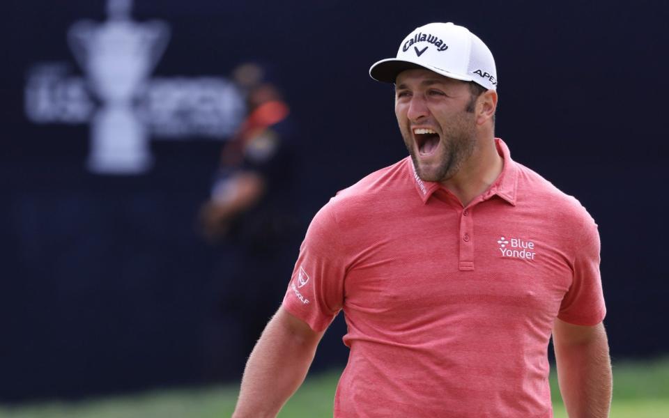 Rahm cannot hide his excitement after holing his birdie putt on the 18th - GETTY IMAGES