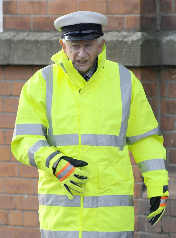 Robert Fyfe as the school crossing patrol officer Malcolm Lagg, filming for Coronation Street, 2012 .