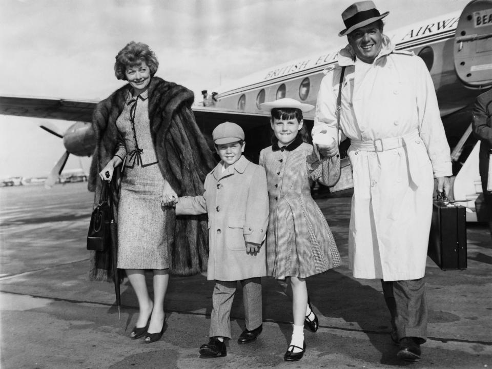 Ball, Arnaz and their children Desi Jr. and Lucie arriving in London in June 1959. Ball and Arnaz would divorce the next year.