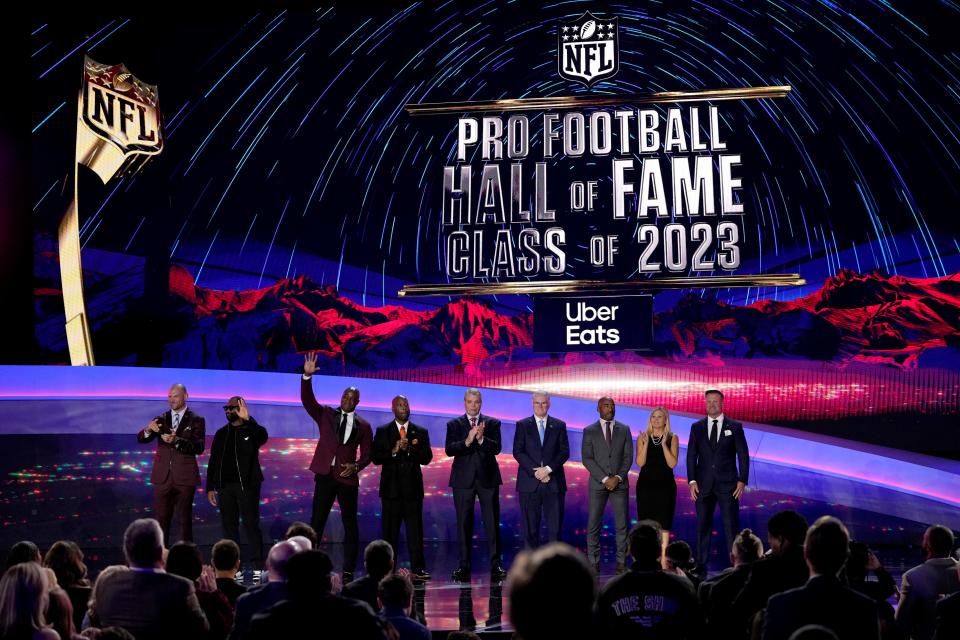 The Pro football Hall of Fame's Class of 2023 — with Joe Klecko standing in the middle — poses on stage during the NFL Honors award show, Feb. 9, 2023, in Phoenix.