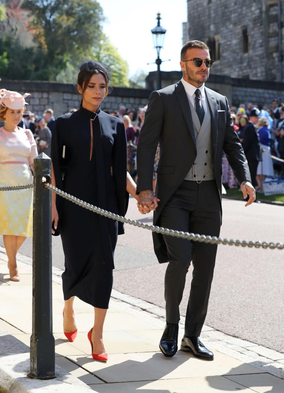 David and Victoria Beckham at Meghan and Harry’s 2018 wedding (PA)