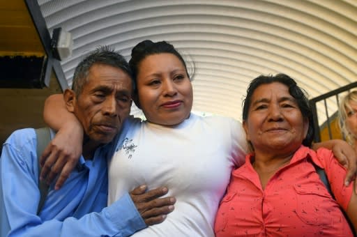 In this file photo taken on February 15, 2018, Teodora Vasquez hugs her parents shortly after being released from the women's Readaptation Center in Ilopango, El Salvador, where she had been jailed for 10 years