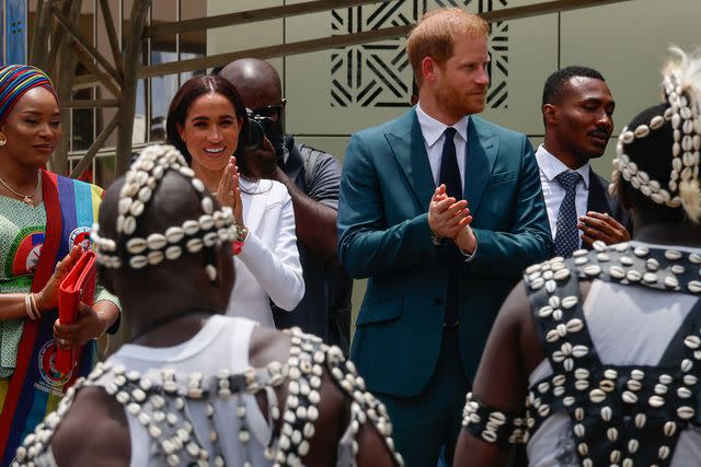 <p>AFOLABI SOTUNDE/EPA-EFE/Shutterstock</p> Meghan Markle and Prince Harry are welcomed at the Nigerian Defense Headquarters in Abuja, Nigeria, on May 10, 2024