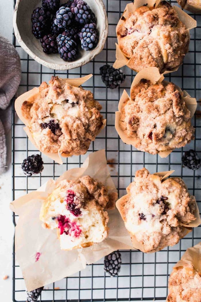 Blackberry streusel muffins in a cooling rack.