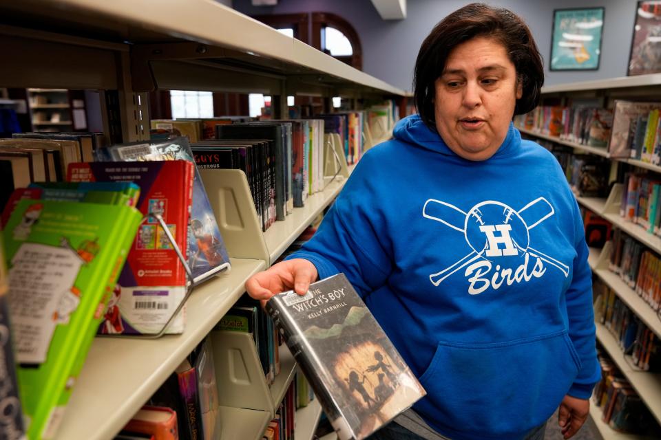 Mirna Eads, of Fort Thomas, takes a quick look for books she finds questionable at the Fort Thomas branch public library Jan. 8. Eads, who has no children in the district, challenged dozens of books at Fort Thomas Independent School District, Campbell County Schools and Newport Independent Schools during the 2022-23 school year.