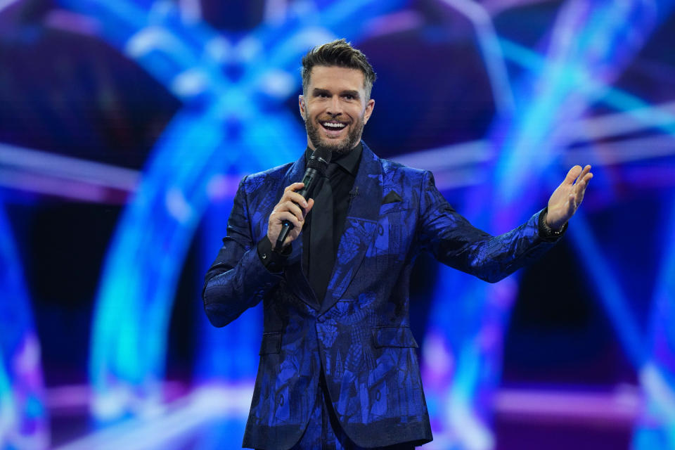 Joel Dommett has presented all three series of the UK version of 'The Masked Singer'. (Bandicoot TV/ITV)