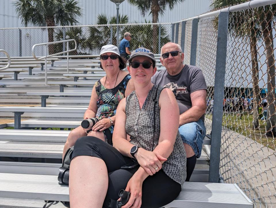 Michaela Fuchs sits with her parents, Ingrid and Johann Fuchs, after the Delta IV Heavy launch. Michaela's parents are visiting her from Germany.