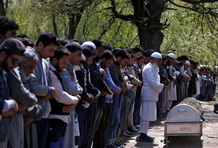 People offer funeral prayers for Ali Mohammed Dagga, a driver who according to local media reports died after he was hit by a stone while driving his vehicle during clashes between Kashmir demonstrators and Indian police on Monday evening during a protest against recent civilian killings, in Srinagar, India April 11, 2017. REUTERS/Danish Ismail