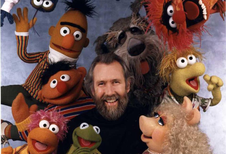 Jim Henson, with his puppet creations.