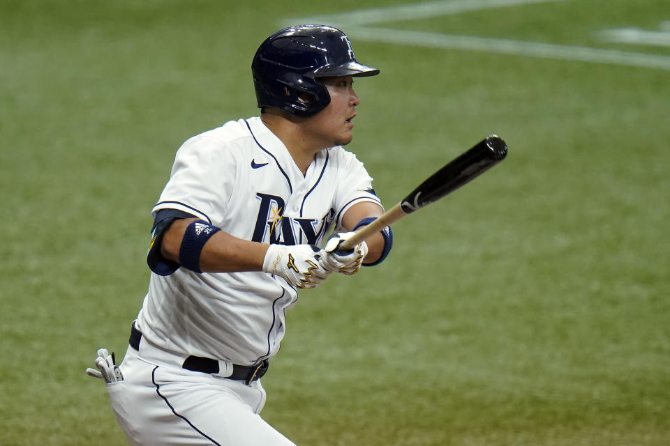 Tampa Bay Rays' Yoshi Tsutsugo, of Japan, follows his single off New York Yankees starting pitcher Corey Kluber during the third inning of a baseball game Friday, April 9, 2021, in St. Petersburg, Fla. (AP Photo/Chris O'Meara)