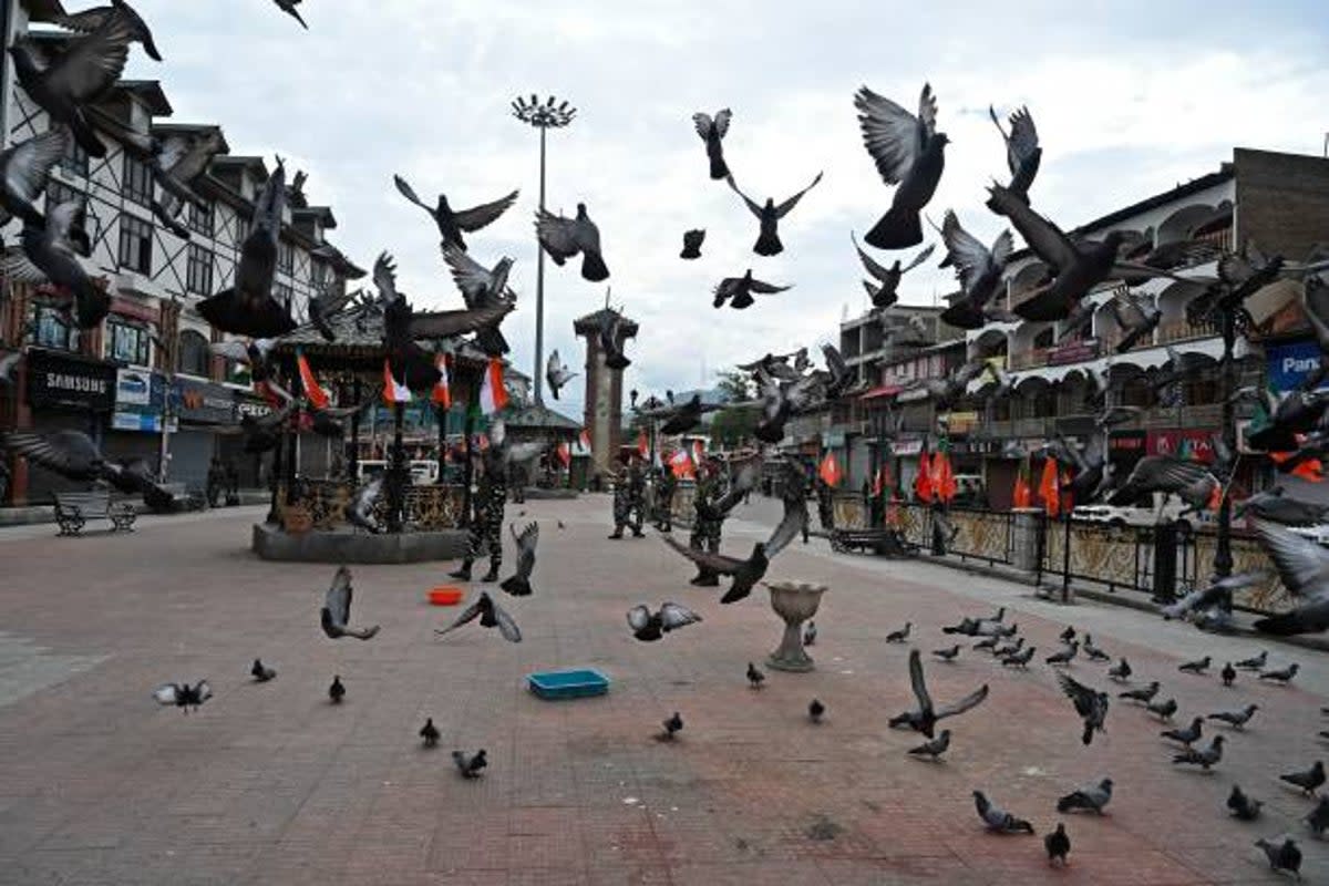 Indian paramilitary troopers patrol during the Bharatiya Janata Party's (BJP) Tiranga bikers rally at the clock tower in Lal Chowk area of Srinagar on (AFP via Getty Images)