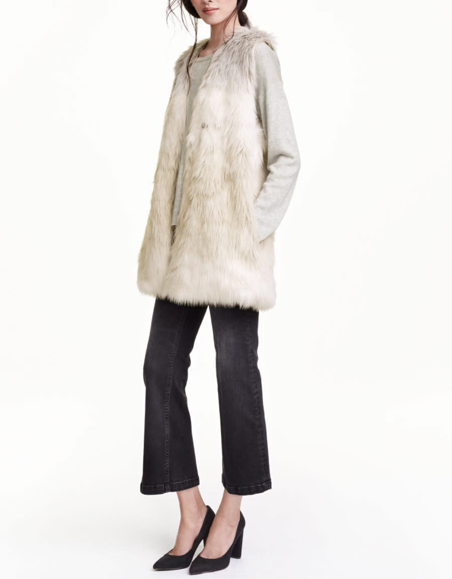 A faux-fur vest adds a sumptuous feeling to a casual outfit.