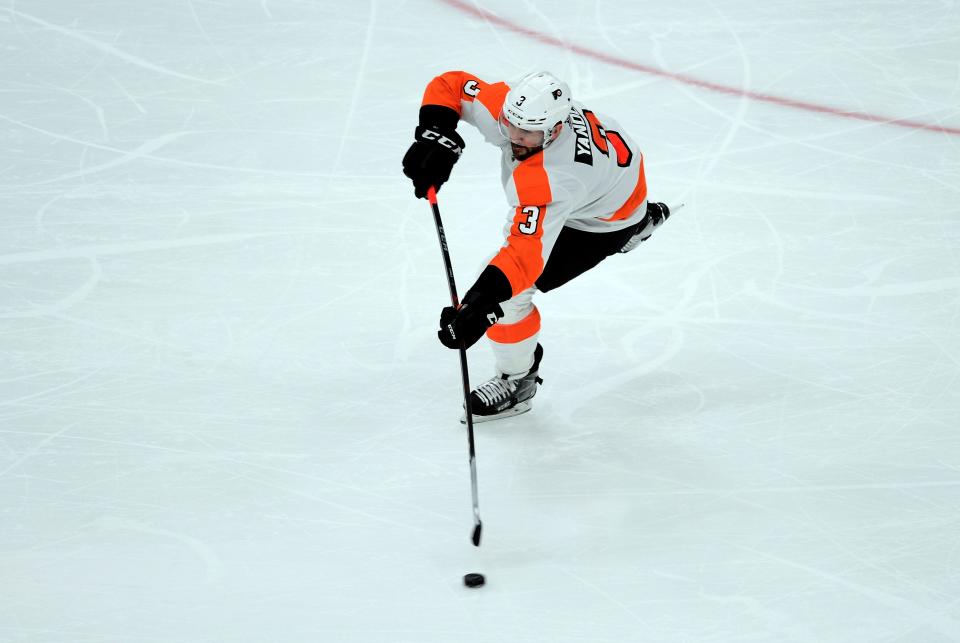 Dec 11, 2021; Glendale, Arizona, USA; Philadelphia Flyers defenseman Keith Yandle (3) passes the puck against the Arizona Coyotes during the first period at Gila River Arena. Mandatory Credit: Joe Camporeale-USA TODAY Sports