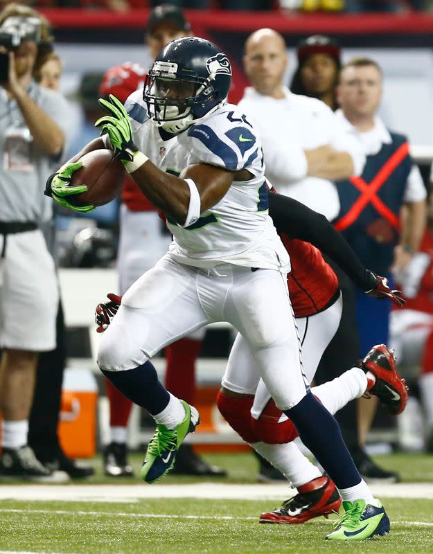 Seattle Seahawks running back Robert Turbin carries the ball against the Atlanta Falcons during the fourth quarter in their NFL NFC Divisional playoff football game in Atlanta