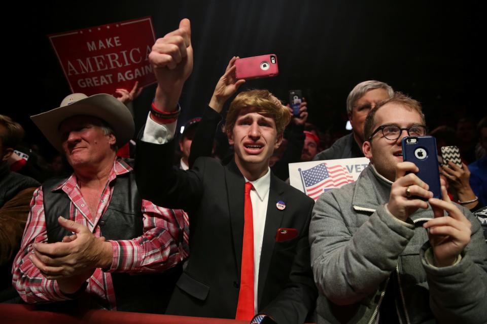 Supporters cheer during a campaign rally by Republican presidential nominee Donald Trump in Manchester, New Hampshire, U.S. November 7, 2016. REUTERS/Carlo Allegri