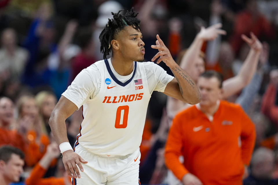 Illinois guard Terrence Shannon Jr. (0) celebrates after a three-point basket against Duquesne in the second half of a second-round college basketball game in the NCAA Tournament, Saturday, March 23, 2024, in Omaha, Neb. (AP Photo/Charlie Neibergall)