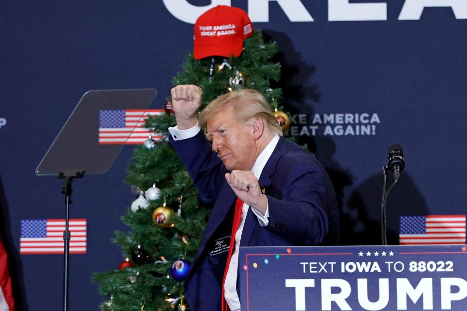 Former President and 2024 presidential hopeful Donald Trump gestures during a campaign event in Waterloo, Iowa, on Dec. 19, 2023. An appeals court in Colorado on Dec. 19, 2023 ruled Trump cannot appear on the state's presidential primary ballot because of his involvement in the attack on the Capitol in Jan. 2021.