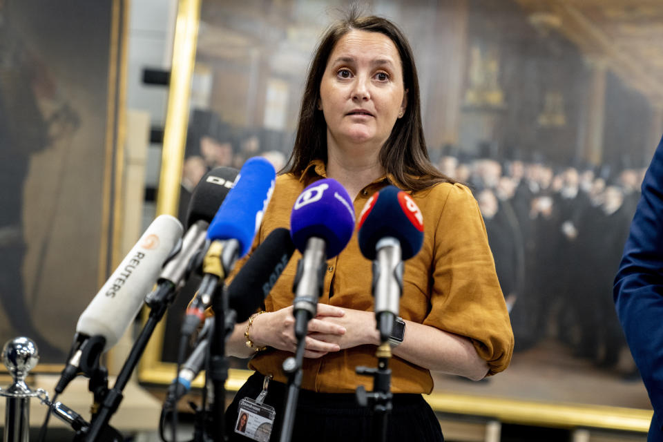 Conservation technician Nina Wajnman speaks as artworks saved from Boersen during the fire are shown at the National Museum's warehouse in Vinge, Denmark, on Tuesday, June 4, 2024. Boersen, in Copenhagen, caught fire on April 16, 2024. More than 300 art objects were saved from the burning building. (Ida Marie Odgaard/Ritzau Scanpix via AP)