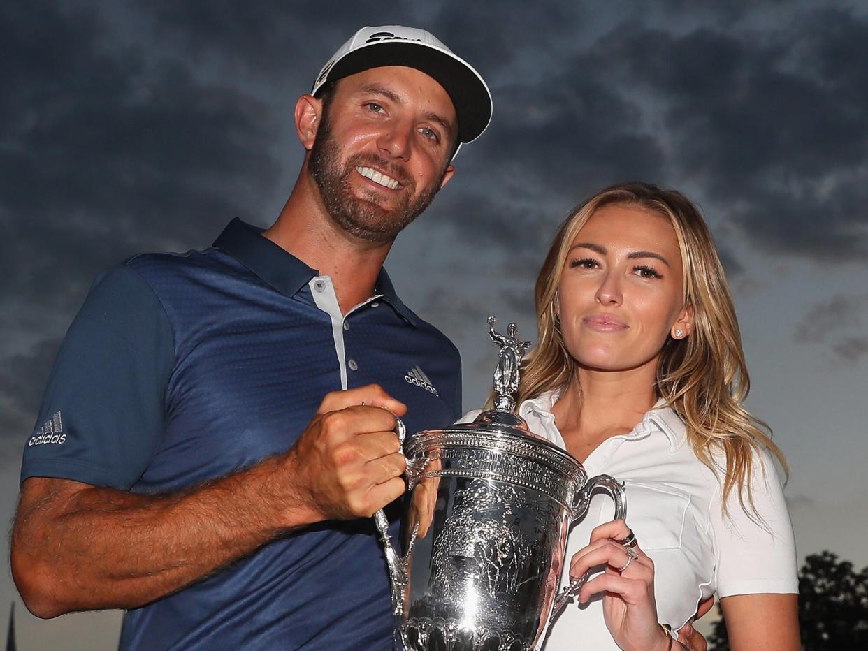 Dustin Johnson of the United States celebrates with partner Paulina Gretzky after winning the U.S. Open at Oakmont Country Club on June 19, 2016 in Oakmont, Pennsylvania