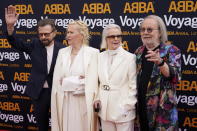 Members of ABBA, from left, Bjorn Ulvaeus, Agnetha Faltskog, Anni-Frid Lyngstad and Benny Andersson arrive for the ABBA Voyage concert at the ABBA Arena in London, Thursday May 26, 2022. ABBA is releasing its first new music in four decades, along with a concert performance that will see the "Dancing Queen" quartet going entirely digital. The virtual version of the band will begin a series of concerts on Thursday. (AP Photo/Alberto Pezzali)