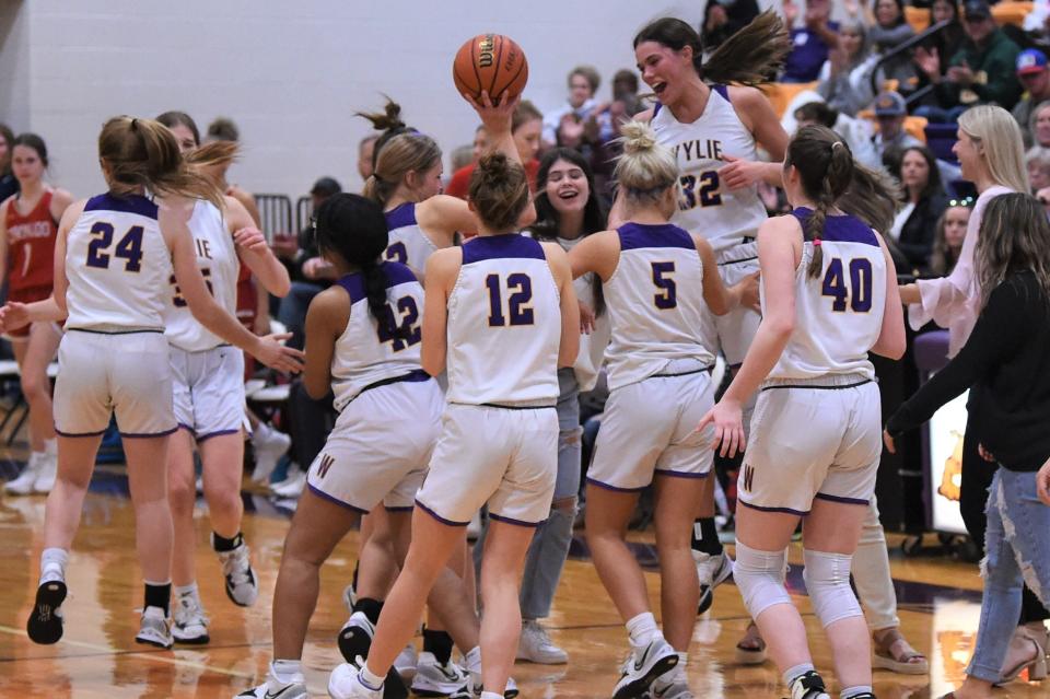 Wylie celebrates winning Friday's game 51-48 against Lubbock Coronado. The victory avenged the road loss earlier in the season and pulled the Lady Bulldogs into a tie for third place in the District 4-5A standings.