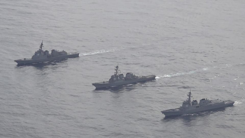 FILE - In this photo provided by South Korea Defense Ministry, Japan Maritime Self-Defense Force's destroyer Atago, left, U.S. Navy's Arleigh Burke-class guided-missile destroyer USS Barry, center, and South Korean Navy's Aegis destroyer King Sejong the Great, right, sail during a joint missile defense drill among South Korea, the United States and Japan in the international waters of the east coast of Korean peninsula, on Feb. 22, 2023. (South Korea Defense Ministry via AP, File)