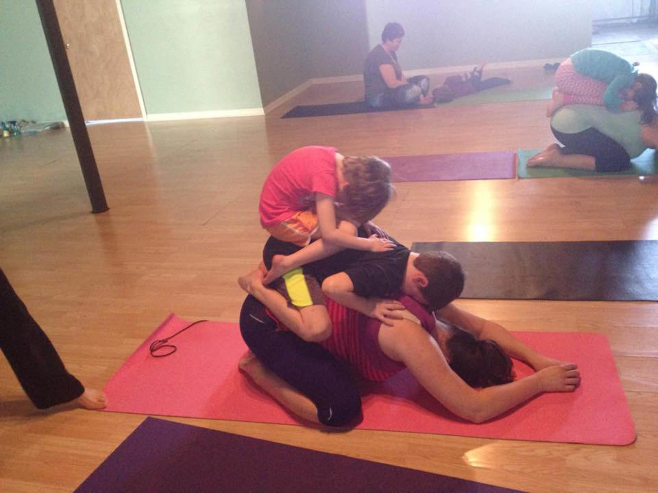 Family yoga: Partnering with three people instead of the normal two. Love my little family. We are a team.