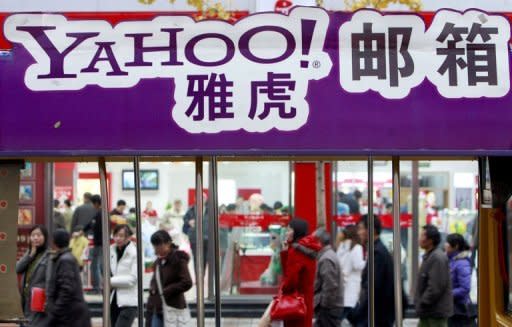 Pedestrians walk past a Yahoo! billboard in Beijing. A Chinese dissident convicted based on evidence provided by US Internet giant Yahoo! was released from prison on Friday after serving a 10-year term for subversion, his wife said