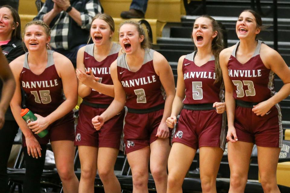 Danville's Addison Davis (15), Danville's Kortney Bynum (4), Danville's Maddy Wethington (5), Danville's Mika Baxter (2), and Danville's Ava Walls (33) cheer on their team from the bench as the Danville Warriors face the Tri-West Hendricks Bruins during the IHSAA Class 3A Girls Basketball Sectional Semifinals, February 3, 2023, at Lebanon High School.