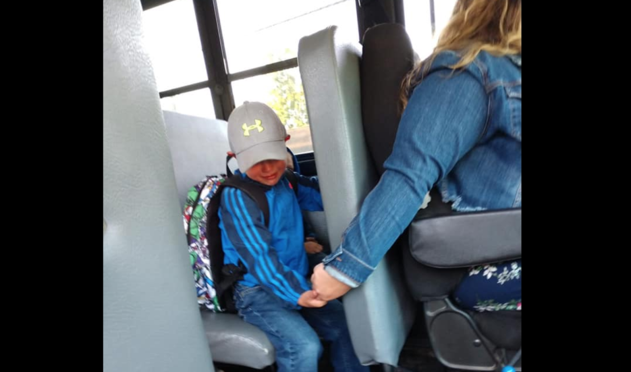 A Wisconsin bus driver, Isabel Lane, comforts a student on his first day of school. (Photo: Facebook)