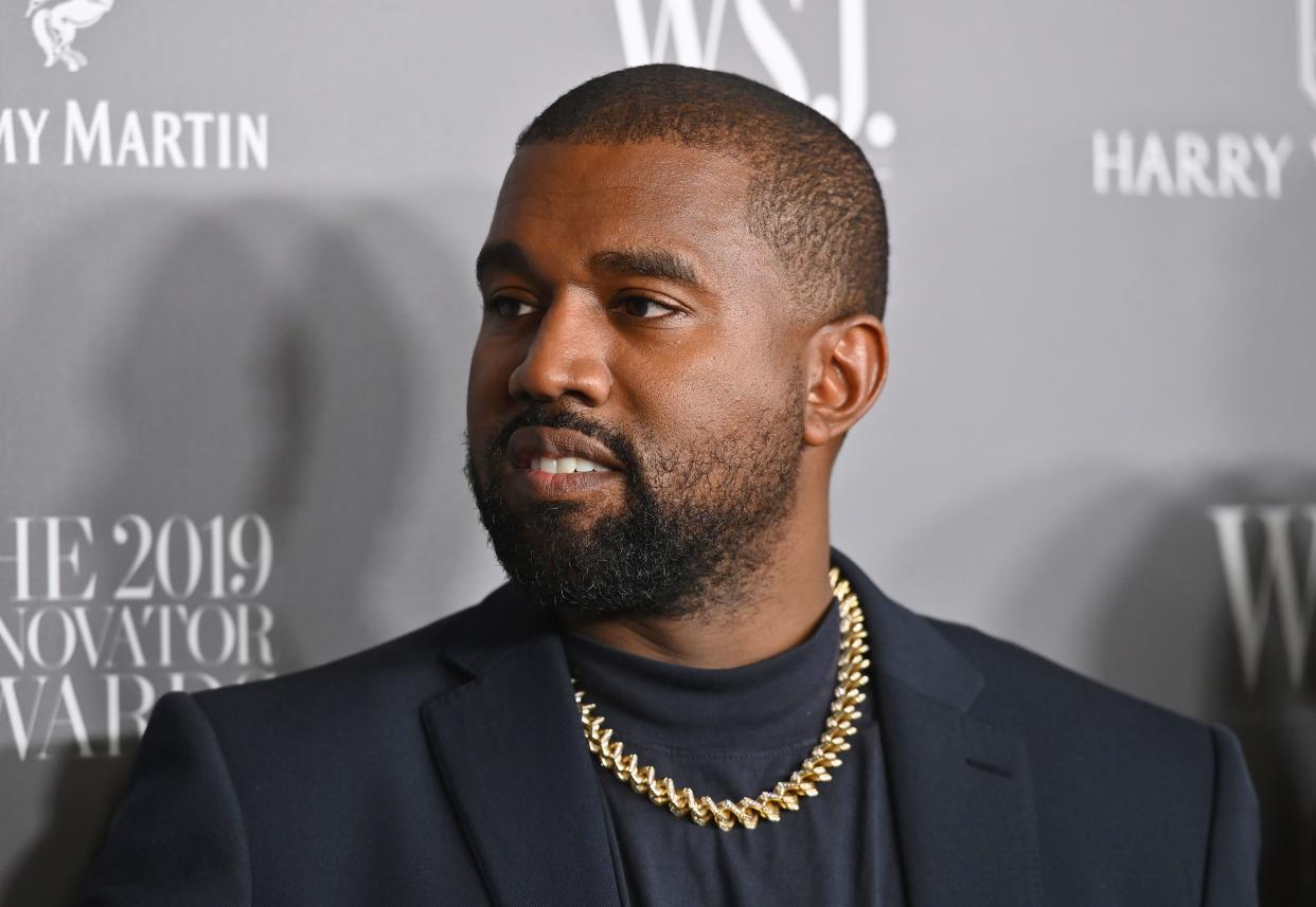Kanye West's representative claims he is banned from performing at the Grammys due to his recent controversial behavior towards his ex-wife Kim Kardashian and her new boyfriend Pete Davidson. (Photo: Angela Weiss / AFP / Getty Images) 