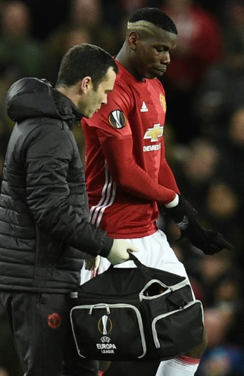 Manchester United's Paul Pogba (right) leaves the field after injuring his hamstring in the Europa League victory over FC Rostov at Old Trafford on March 16, 2017