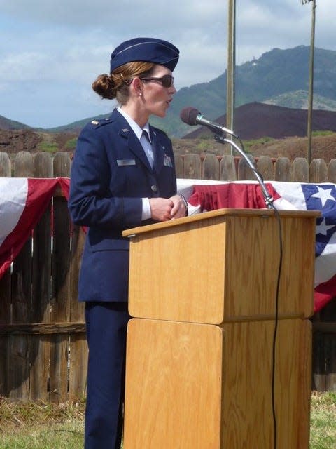 Ingrid Kaat, then Detachment Commander, speaks at an event while being stationed at Ascension Island.