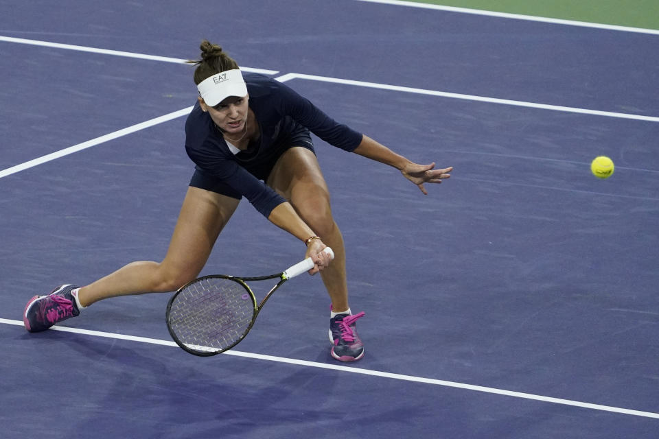 Veronika Kudermetova, of Russia, returns a shot to Naomi Osaka, of Japan, at the BNP Paribas Open tennis tournament Saturday, March 12, 2022, in Indian Wells, Calif. (AP Photo/Mark J. Terrill)