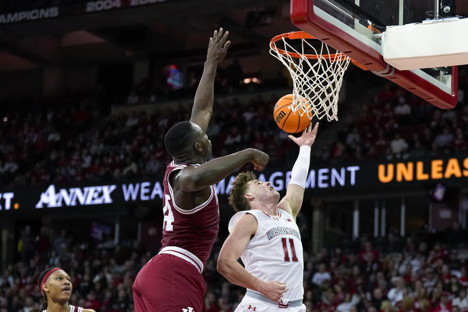 Wisconsin's Max Klesmit (11) shoots against Indiana's Payton Sparks during the second half of an NCAA college basketball game Friday, Jan. 19, 2024, in Madison, Wis. (AP Photo/Andy Manis)