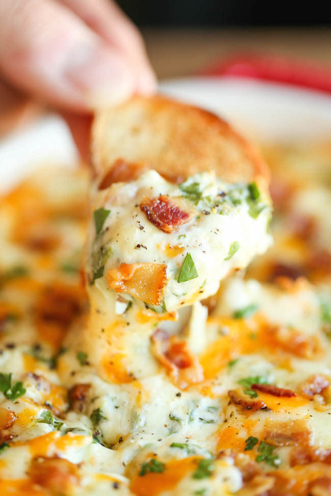 <strong>Get the <a href="http://damndelicious.net/2014/12/29/cheesy-bacon-spinach-dip/" target="_blank">Cheesy Bacon Spinach Dip recipe</a> from Damn Delicious</strong>