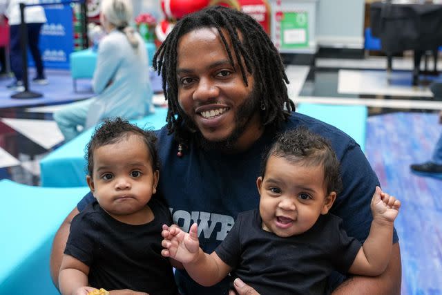 <p>Cook Children's Health Care System</p> James Finley with his daughters JamieLynn and AmieLynn Finley