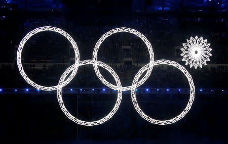 Four of five Olympic Rings are seen lit up during the opening ceremony of the 2014 Sochi Winter Olympics, February 7, 2014. REUTERS/Lucy Nicholson/File Photo