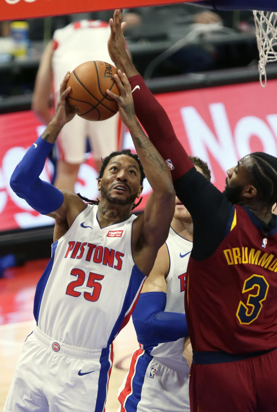 Detroit Pistons guard Derrick Rose, left, goes to the basket against Cleveland Cavaliers center Andre Drummond, right, during the first half of an NBA basketball game Saturday, Dec. 26, 2020, in Detroit. (AP Photo/Duane Burleson)