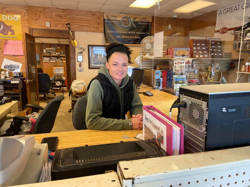 Anslee Payne poses for photo at her job at Owens Farm Equipment in Homer