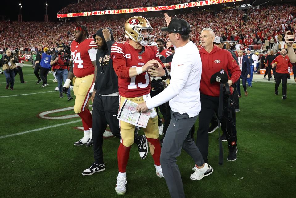 San Francisco 49ers coach Kyle Shanahan, a Texas ex, celebrates with quarterback Brock Purdy after Sunday's 34-31 win over the Detroit Lions in the NFC title game. The Niners will face the Kansas City Chiefs in the Super Bowl on Feb. 11.