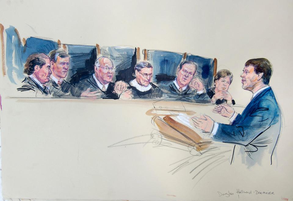 courtroom sketch shows male lawyer in blue suit arguing before 6 supreme court justices in robes