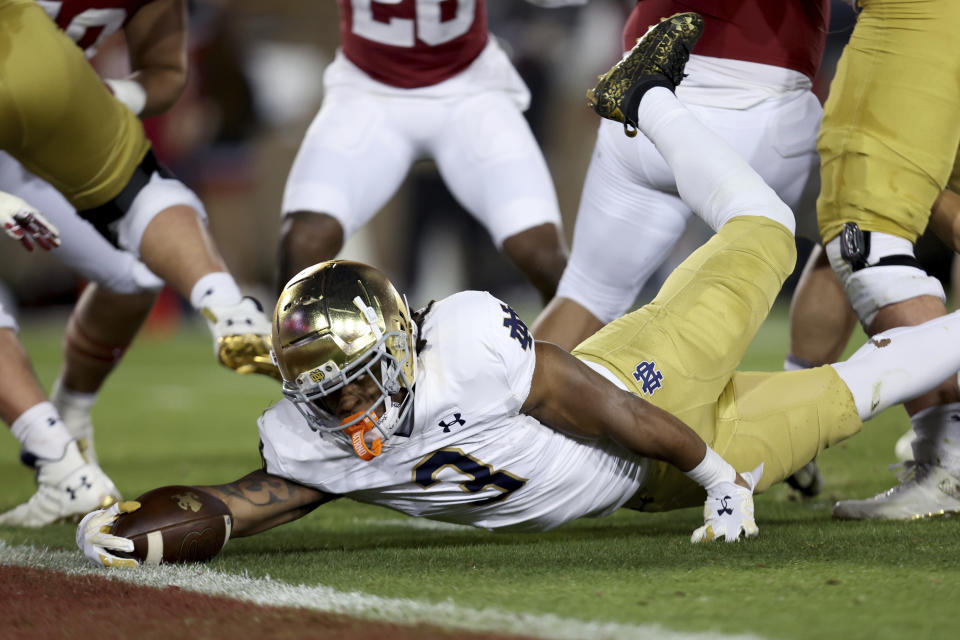 Notre Dame running back Gi'Bran Payne (3) scores a touchdown against Stanford during the first half of an NCAA college football game in Stanford, Calif., Saturday, Nov. 25, 2023. (AP Photo/Jed Jacobsohn)