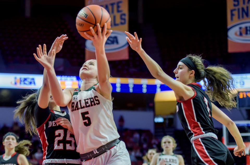 Lincoln's Kloe Froebe (5) goes to the basket against Deerfield's Lexi Kerstein, left, and Nikki Kerstein in the second half of the Class 3A state semifinals Friday, March 3, 2023 at CEFCU Arena in Normal. The Railers advanced to the title game with a 76-56 win over the Warriors.