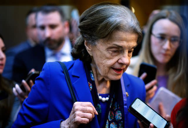 Chip Somodevilla/Getty Sen. Dianne Feinstein is questioned by reporters after announcing that she would not seek reelection in 2024