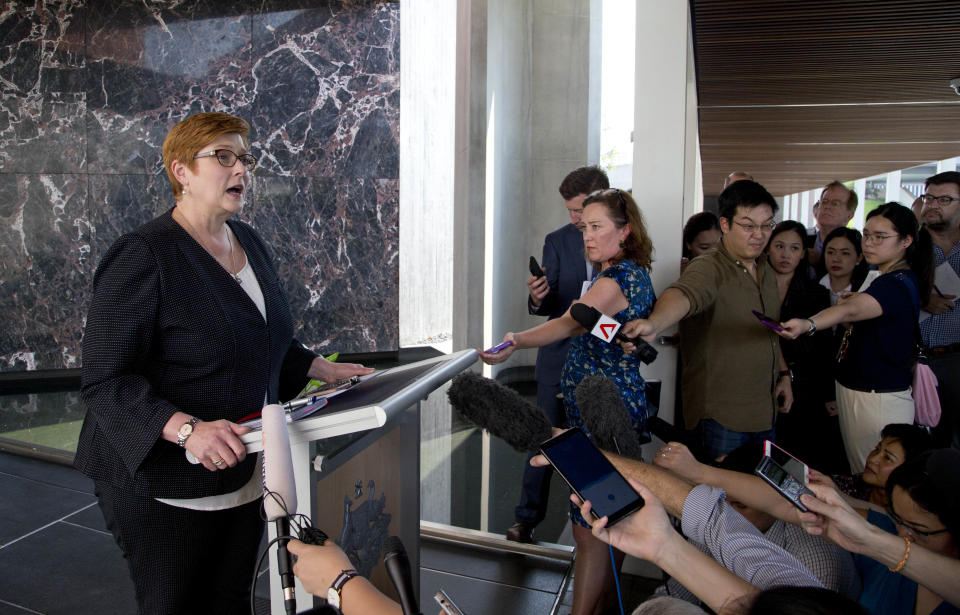 Australia's Foreign Minister Marise Payne, left, gestures as she answers a journalist's question in Bangkok, Thailand, Thursday, Jan. 10, 2019. Visiting Thailand on Thursday, Payne praised her hosts for their handling of the case of the young Saudi woman fleeing her family to seek asylum in Australia, but said she also reminded them of continuing concern about a Bahraini soccer player granted asylum in Australia who is in Thai detention. (AP Photo/Gemunu Amarasinghe)