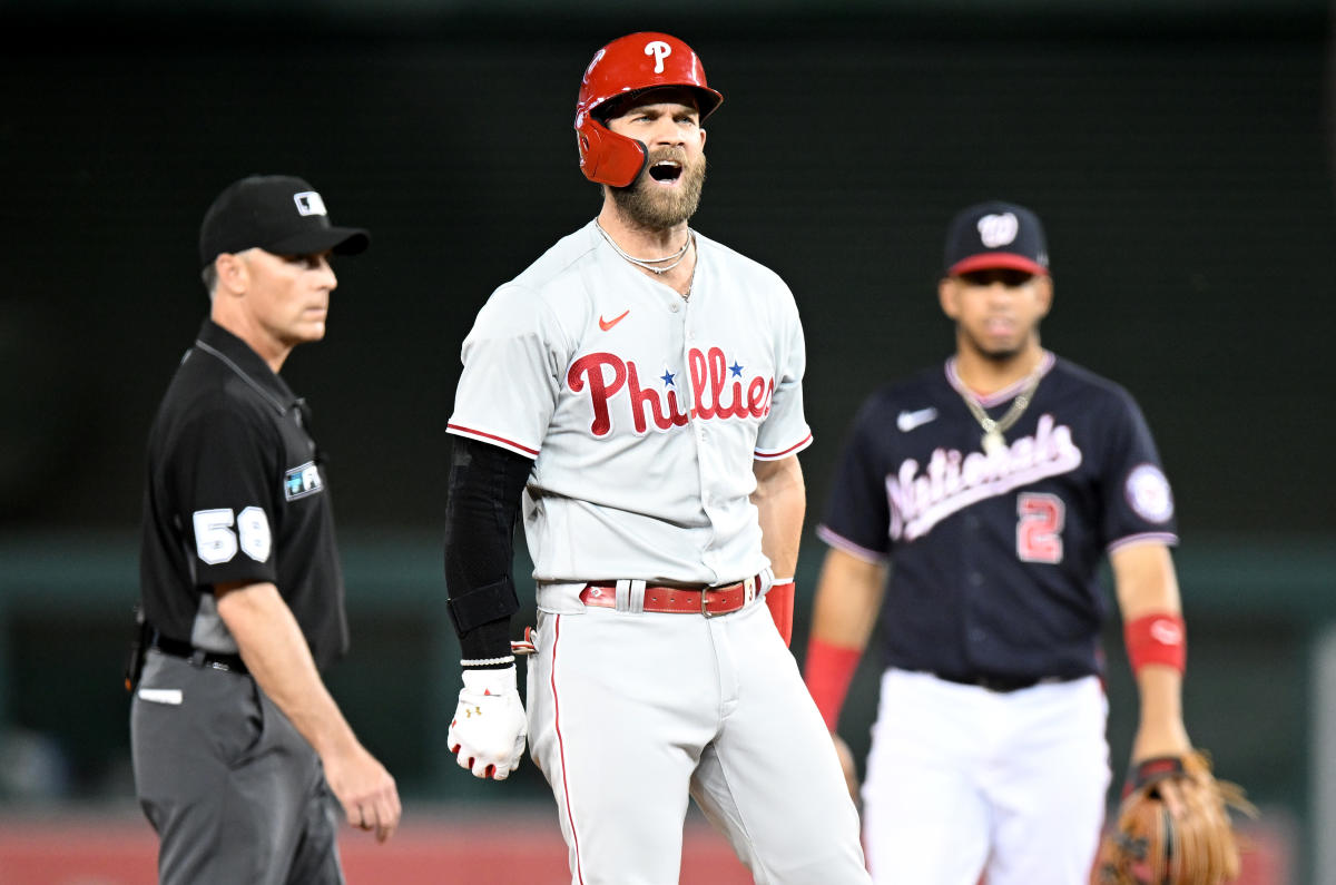 Phillies star Bryce Harper makes catch tumbling into photo pit in first  career start at first base - WTOP News